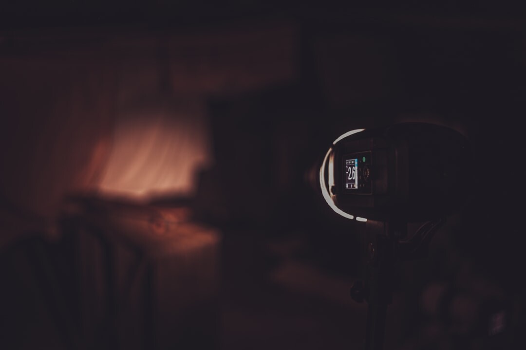 Humanoid robot with glowing eyes in a dark studio